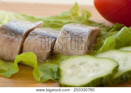 Appetizer Of Herring, Cucumbers, Tomatoes And Lettuce