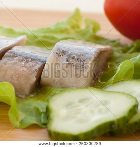 Appetizer Of Herring, Cucumbers, Tomatoes And Lettuce