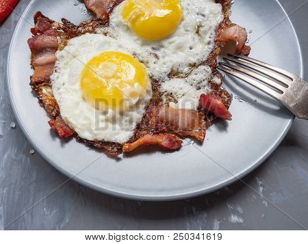 Fried Eggs From Two Eggs With Fried Bacon And Red Pepper, Cupronickel Plug