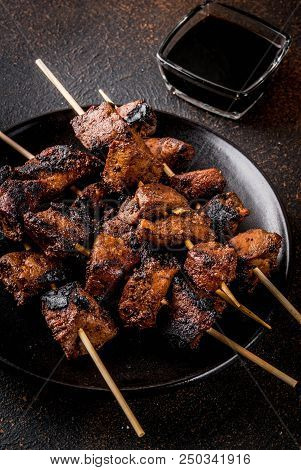 Grilled Beef Liver On Skewers, With Teriyaki Or Soy Sauce, Yakitori, Dark Rusty  Table Copy Space To