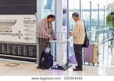 Bangkok, Thailand - 21 July 2018 - Male Tourists Charge Their Phone At Free Charging Station In Suva