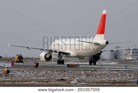 Passenger Jet Moving On The Runaway Tarmac