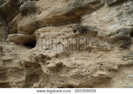 Grignan, France - July 16, 2018: Photography Showing An Old Wall Turning Into Stand. The Photography