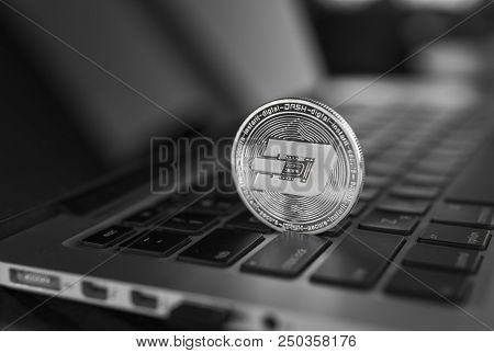 Dash Coin Symbol On Laptop. Concept Financial Currency, Crypto Currency Sign. Blockchain Mining. Dig