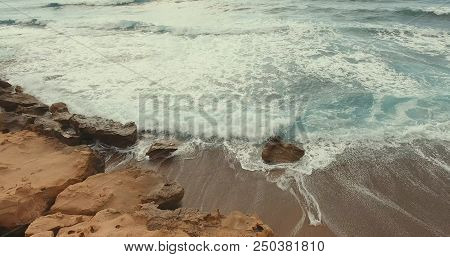 Aerial Photography. The Stone Shore Was Covered By A Sea Wave. Sunny Summer Day.