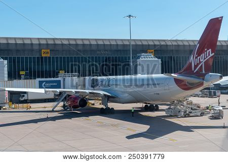 Manchester, United Kingdom - June 29th, 2018: Aeroplane At A Terminal Gate With Attached Airbridge