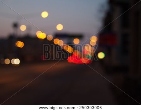 Defocused Night Lights Looks Like Colorful Dots Arond The Road