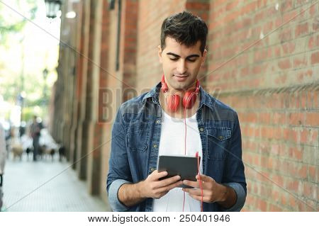 Man Using A Tablet.