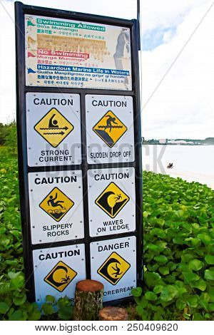 Danger Signs With Various Beach Rules On It.