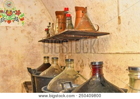 Wine Demijohns In Moravian Wine Cellar.  Full Carboys Of Wine. Jimmyjohns In Wine Cellar.