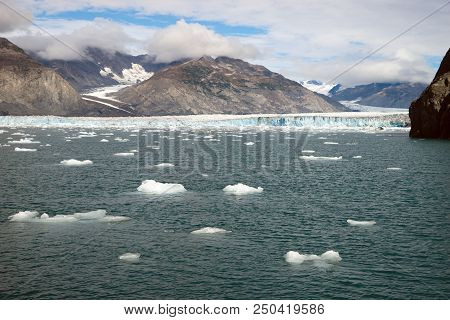 A Glacier Ice Flow Moves Into The Pacific Ocean In The Northern United States Territory Of Alaska