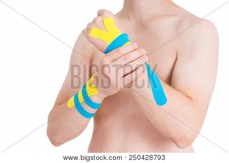 Kinesiology Taping On Human Hand, Isolated On White Background