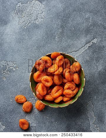 Dried Apricots On Gray Background. Witn Copy Space. Top View.