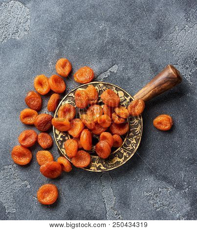 Dried Apricots On Gray Background. Witn Copy Space. Top View.