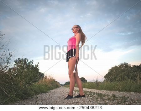 Teen Majorette Girl Twirling Baton Outdoors