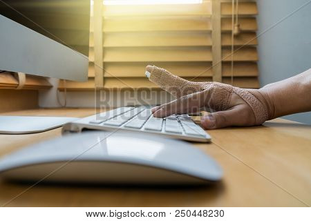Closeup Hand With Weir Wrist To Working With Computer Keyboard With Mouse On The Wooden Table, Hardw