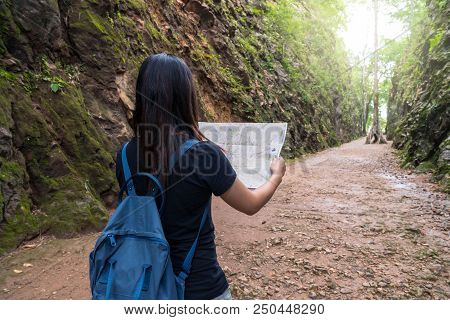 Back Side Of Young Traveler See The Map In The Deep Forest, Hellfire Pass At Kanchanaburi, Thailand,