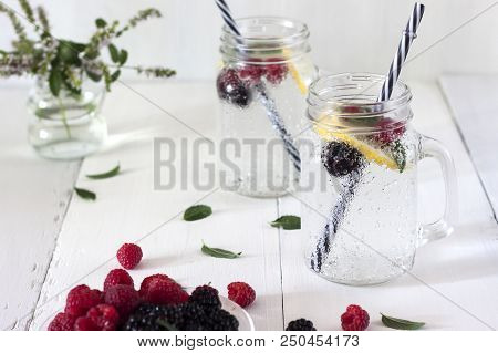 A Cooling Lemon Drink In A Glass Cup On A Wooden Table