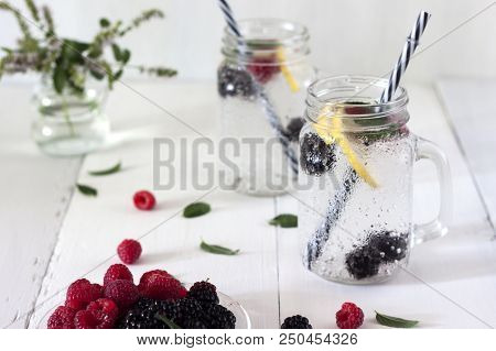 A Cooling Lemon Drink In A Glass Cup On A Wooden Table
