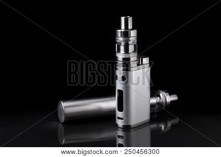 Metallic Electronic Cigarette Or Vaping Device On Black Background