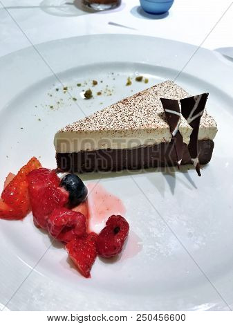 Chocolate Pie With Meringue And Berries On The Side