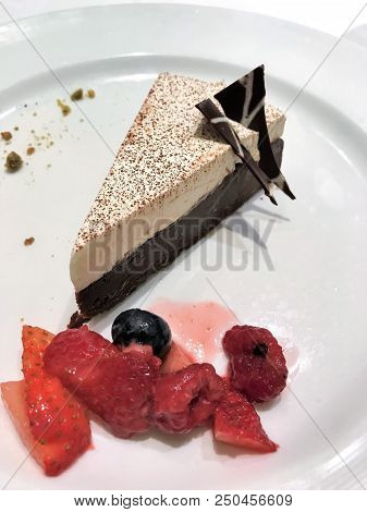Chocolate Pie With Meringue And Berries On The Side