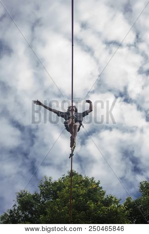 Puerto Bossetti, Argentina - 29/01/18: Slackline Athlete Bruno Madra Doing Highline Under Blue Sky