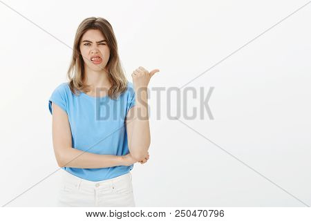 Never Eat At This Cafe, It Is Awful. Portrait Of Disgusted Displeased Attractive Female Coworker In 