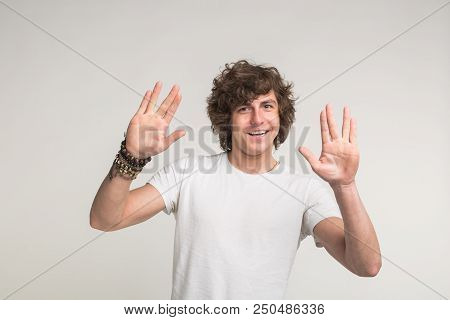 Portrait Of White Handsome Young Men Having Fun In White T-shirt With Stylish Bracelet