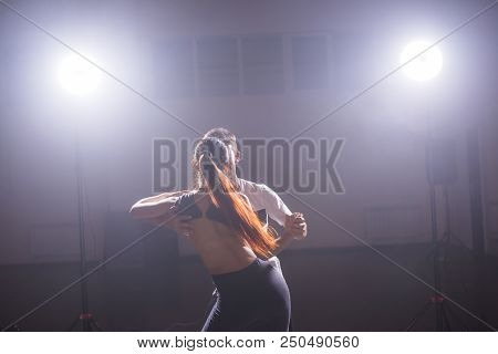 Young Couple Dancing Social Danse Kizomba Or Bachata Or Semba Or Taraxia In Dancing Class Background