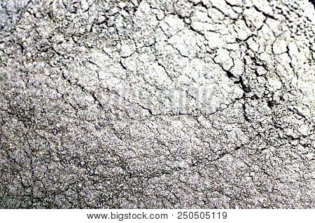 Gray Powder Texture. Inhomogeneous Texture With Cracks.