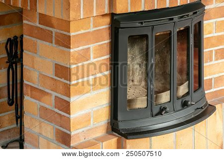 Fireplace, Detail Of Home Interior. Fireplace Covered With Fireclay Bricks.