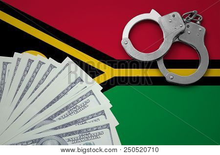 Vanuatu Flag  With Handcuffs And A Bundle Of Dollars. The Concept Of Illegal Banking Operations In U