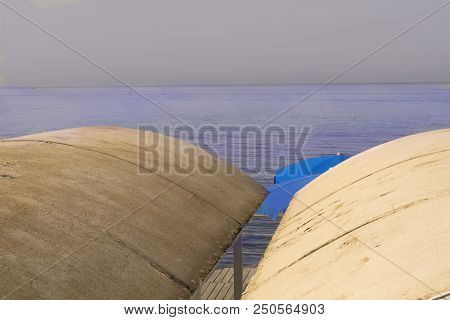 Colors At Sea With Bathing Hut Beach Umbrella And Lifejacket
