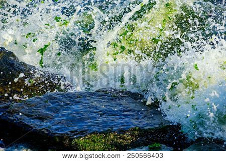 Waves And Stones On The Beach In Istanbul. Abstraction