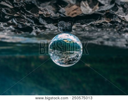 Mountain Scenery Reflection In A Glass Ball, Lensball. Klontalersee In The Swiss Alps