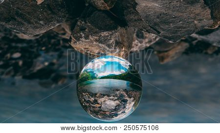 Mountain Scenery Reflection In A Glass Ball, Lensball. Klontalersee In The Swiss Alps