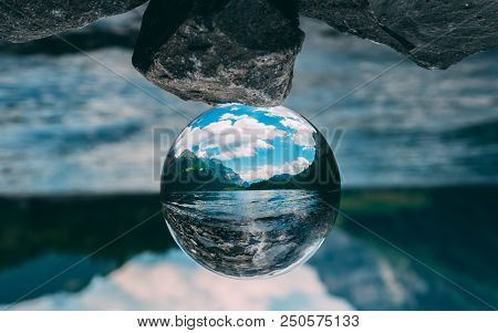 Mountain Scenery Reflection In A Glass Ball, Lensball. Klontalersee In The Swiss Alps