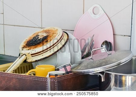 Domestic Dishware Arranged On The Drainboard After Rinsing