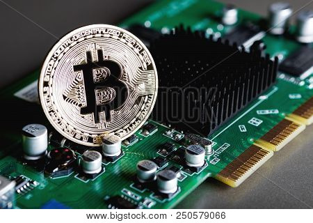 Golden Bitcoin On The Electronic Computer Processor Board. The Concept Of Electronic Currency