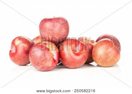 Lot Of Whole Fresh Pluot Interspecific Plums Variety Stack Isolated On White