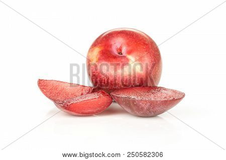 Group Of One Whole Three Slices Of Fresh Pluot Interspecific Plums Variety Isolated On White