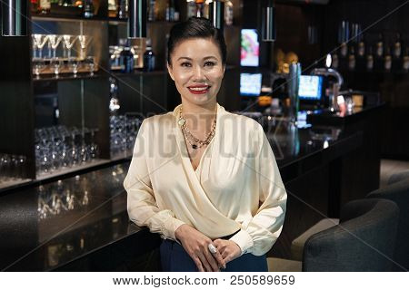 Beautiful Smiling Attractive Young Asian Female In Elegant Clothes Standing Relaxed Leaning On Dark 