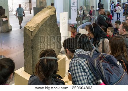 London, United Kingdom - May 15: People Looking On Rosetta Stone In British Museum On May 15, 2018 I