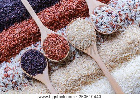 Food Background With Top View Of Five Rows Of Rice In A Wooden Spoon.
