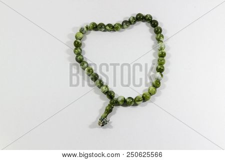 Close-up Shot Of Circled Handmade Green Big Stone Islamic Prayer Beads