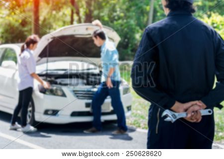 Blur Hands Of Car Mechanic With Wrench Outdoor.