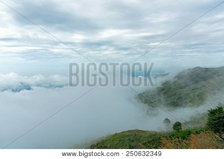 The Mountain Field During Mist Sunrise. Beautiful Natural Landscape In The Summer Time.  Phu Thap Bo