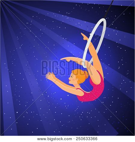 Show In The Circus. Girl Acrobat Performs A Trick In A Ring On Blue Background.
