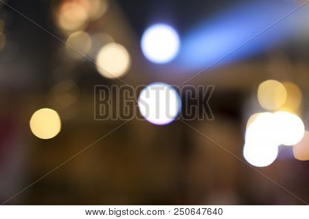 Many Blurred Small Electric Bulbs. A Blurry Photo Of The City